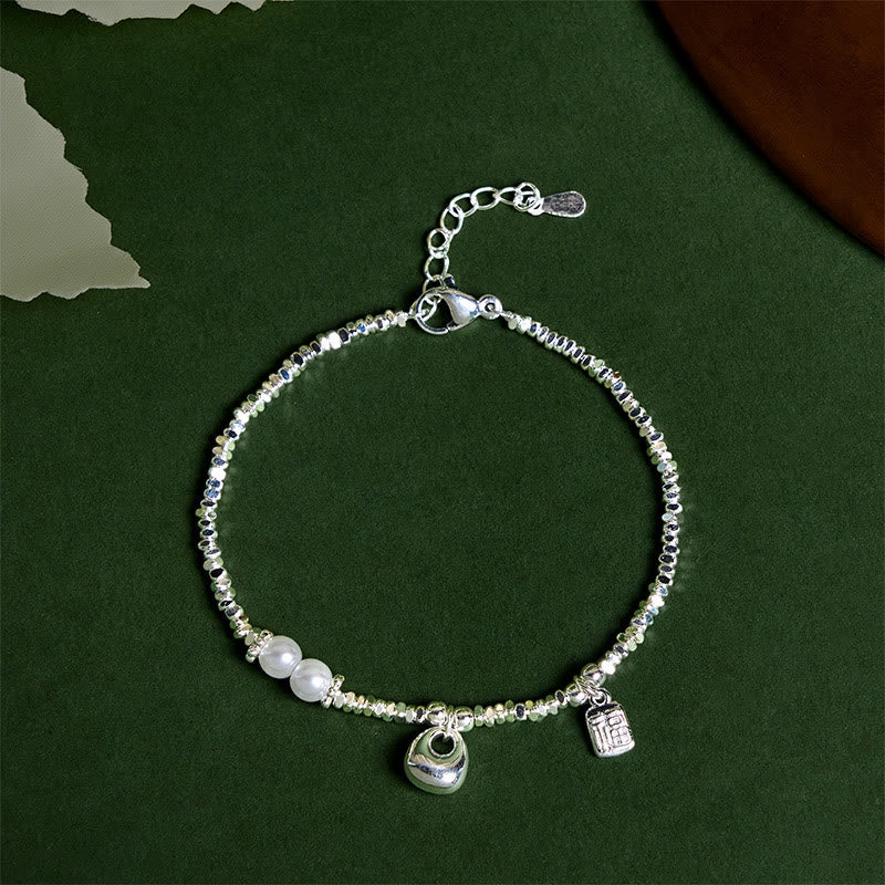 Nimara Ritual Copper Plated Silver Fu Character Purse Pearl Blessing Bracelet