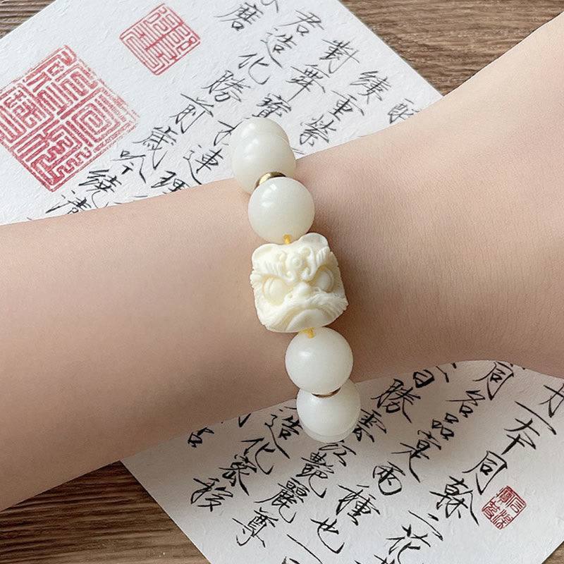 Nimara Ritual Silver Sheen Obsidian Bodhi Seed Ivory Fruit Dancing Lion Protection Bracelet