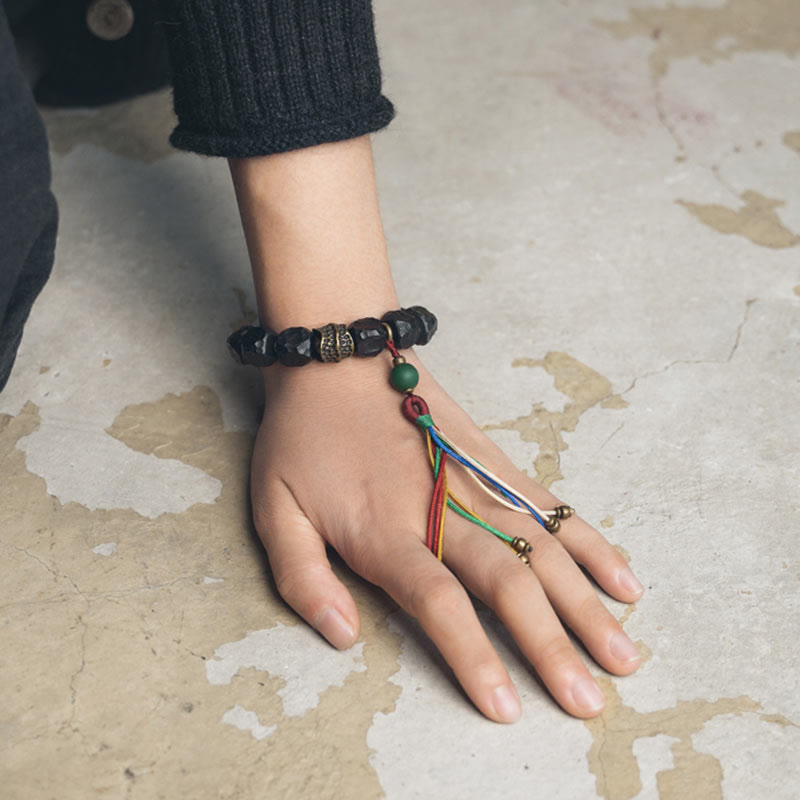 Nimara Ritual Tibet Ebony Wood Copper Peace Tassel Wrist Mala Bracelet