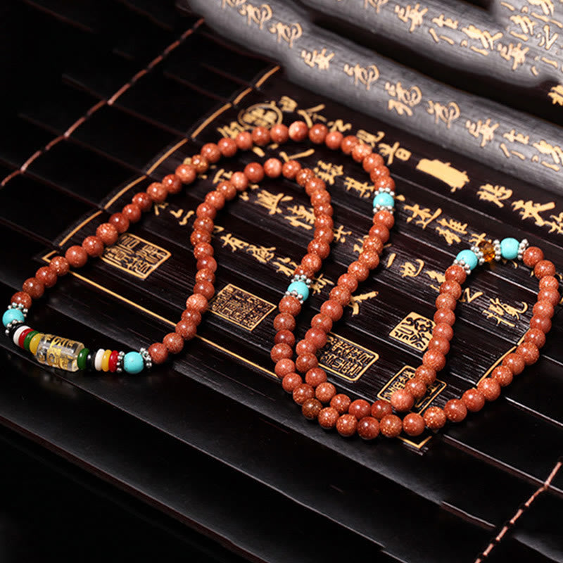 Nimara Ritual 108 Mala Beads Goldstone Om Mani Padme Hum Swastika Confidence Bracelet