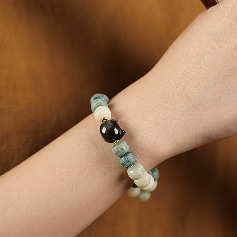 Nimara Ritual Bodhi Seed Om Mani Padme Hum Carved Silver Sheen Obsidian Cat Head Wisdom Bracelet