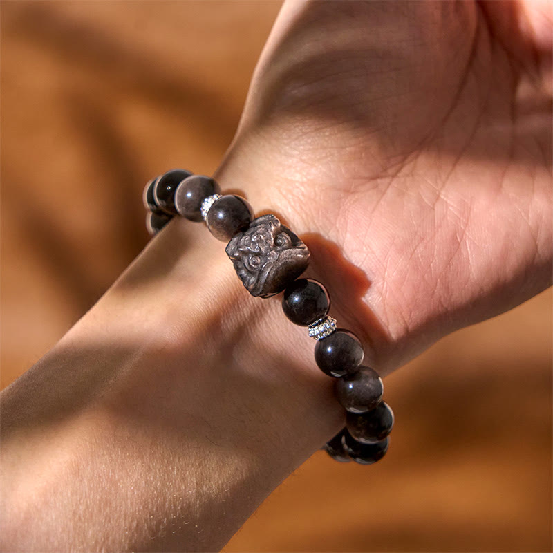 Nimara Ritual Natural Silver Sheen Obsidian Lion Dance Protection Bracelet
