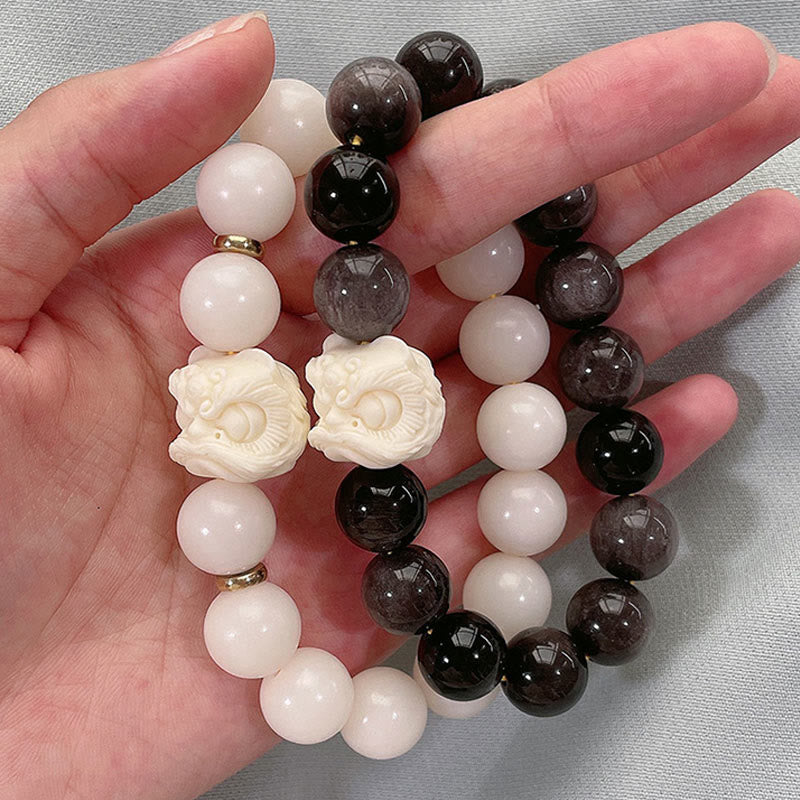 Nimara Ritual Silver Sheen Obsidian Bodhi Seed Ivory Fruit Dancing Lion Protection Bracelet