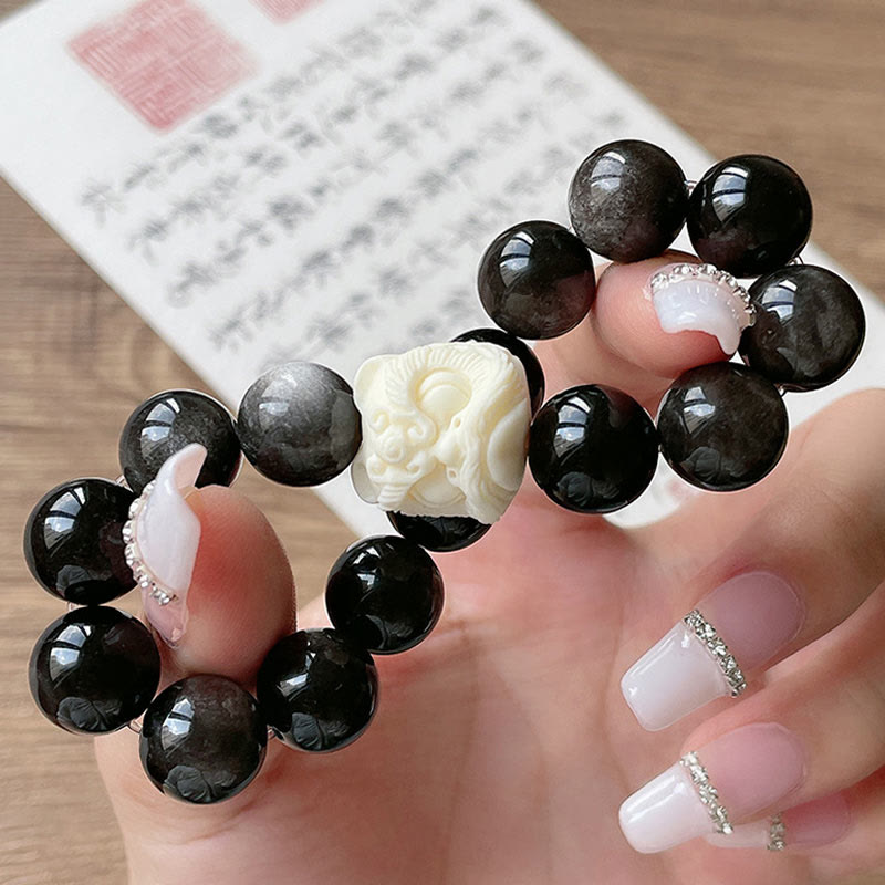 Nimara Ritual Silver Sheen Obsidian Bodhi Seed Ivory Fruit Dancing Lion Protection Bracelet