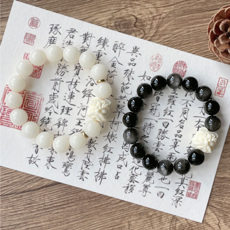 Nimara Ritual Silver Sheen Obsidian Bodhi Seed Ivory Fruit Dancing Lion Protection Bracelet