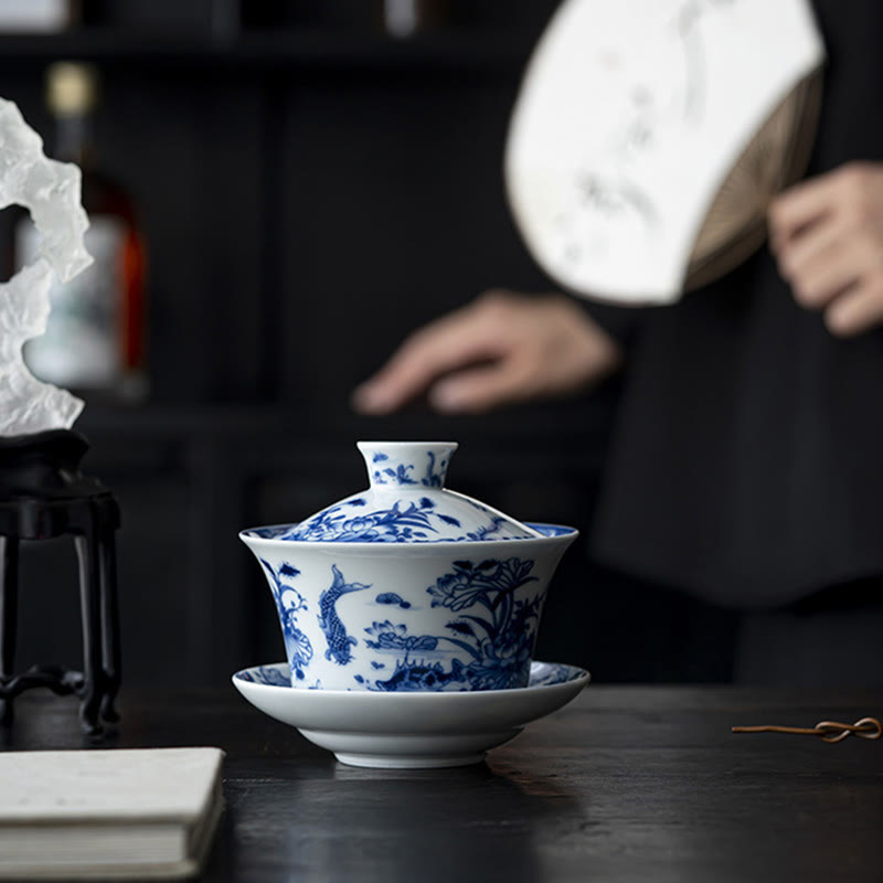Nimara Ritual Blue And White Porcelain Lotus Koi Fish Lion Dance Watermelon Ceramic Gaiwan Sancai Teacup Kung Fu Tea Cup And Saucer With Lid 300ml